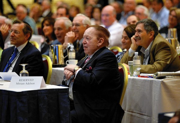LAS VEGAS, NV - MARCH 29: Las Vegas Sands Corp. CEO Sheldon Adelson (C) listens to New Jersey Gov. Chris Christie speak during the Republican Jewish Coalition spring leadership meeting at The Venetian Las Vegas on March 29, 2014 in Las Vegas, Nevada. The Republican Jewish Coalition began its annual meeting wtih potential Republican presidential candidates in attendence, along with Republican super donor Sheldon Adelson. New Jersey Gov. Chris Christie and Former Florida Gov. Jeb Bush are among the highlighted speakers. (Photo by Ethan Miller/Getty Images) ** OUTS - ELSENT, FPG - OUTS * NM, PH, VA if sourced by CT, LA or MoD **